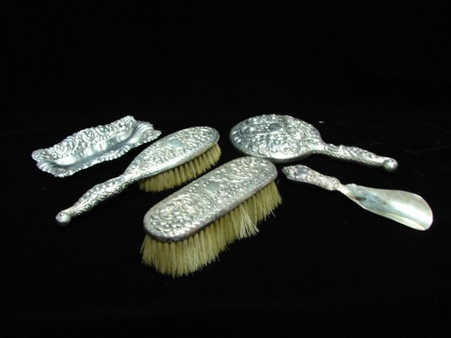 Five Piece Sterling Silver Dresser Set. 19th C.: Comprising a hand mirror, shoe horn, hair brush and shoe brush and pin tray. Hallmarked Hamilton & Desinger. American, 1895 - 1899;