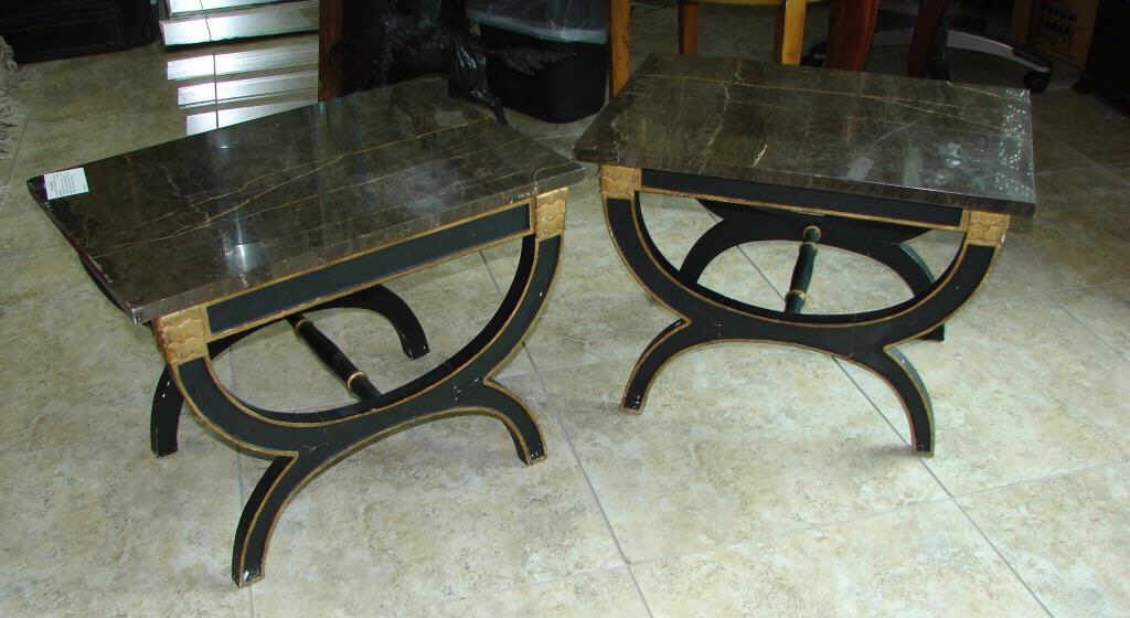 Pair (2) Parcel Gilt Ebonized Low Tables: 18 x 20 x 24 inches. Each. Having rectangular black veined marble tops supported on carved wood "X" frame bases. Condition: Slight chips on corners of marble.