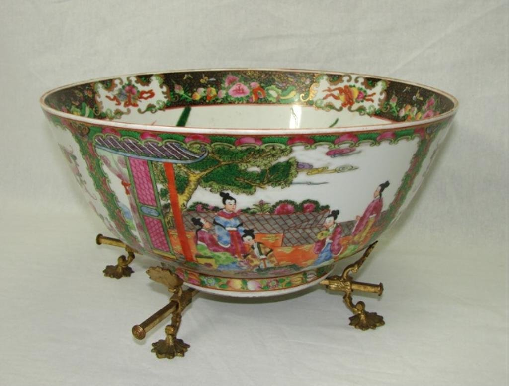 Large Chinese Porcelain Rose Medallion Bowl: With a brass trivet base. Having scenic figural reserves, the interior painted with three goldfish. Height - 8 inches, diameter - 14.5 inches. In good condition.
