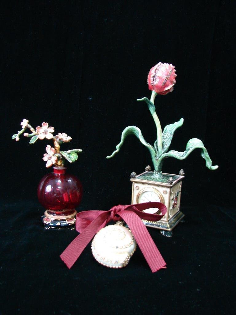 Three Jay Strongwater Items: Perfumer dogwood stopper (height - 6 inches), Shell ornament (height - 2 inches) and Tulip desk clock (height - 8.5 inches). All with the Jay Strongwater label, clock in working order. Excellent condi