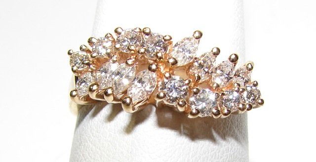 14K Yellow Gold Diamond Lady's Wedding Band: Weight 3.8 grams. "Double Row" wedding ring stamped 14KP each row features 4 round brilliant cut diamonds and 4 marquise-brilliant diamonds all in graduated sizes. total of 16 diamonds approximately 0