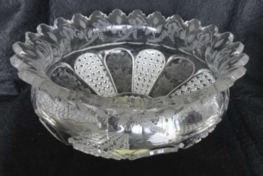 Large American Brilliant Cut Glass Bowl: H. P. Sinclair and Company, maker. Signed "Sinclaire". The bowl has alternating panels of floral intaglios and cane cut panels. The rim is flared with scalloped border and intaglio etchings. Height -