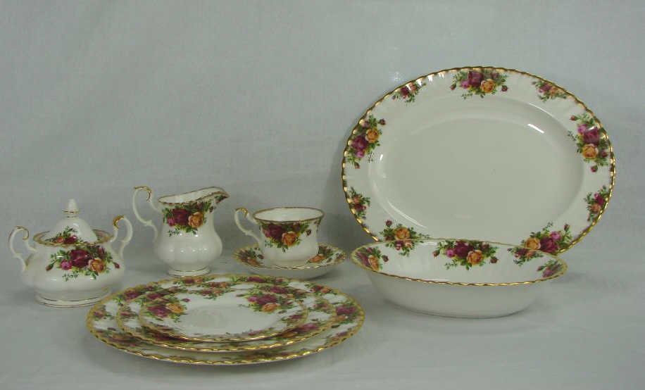 52 Pc. Royal Albert China Old Country Rose: Comprising 12 cups and saucers, 12 dinner plates, 12 salad plates, 12 bread and butter plates, creamer, sugar bowl, oval serving platter and oval entree dish.