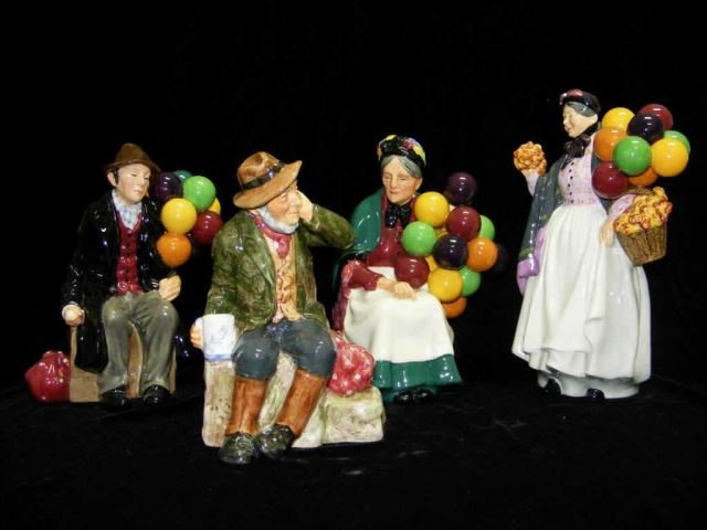 Group Four Royal Doulton Figurines: Biddy Penny Farthing HN1843, The Balloon Man, HN1954, Owd William, HN2042, The Old Balloon Seller, HN1315. Height from 7 inches - 9 inches.