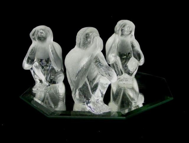 Set of Three Daum, France Art Glass Monkeys: One figurine attached to a mirrored base, otherwise in good condition.