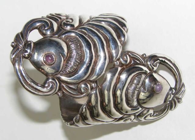 ES Taxco Sterling Koi Fish Cuff Bracelet: 1.74 troy ounces. This bracelet is designed with opposing Koi fish, spring hinged, having amethyst set eyes, hallmarked "ES Sterling Taxco, Mexico, 925"