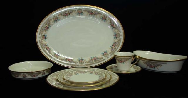 70 Piece Lenox China - Versailles Pattern: Service for 13, including 13 cups, 13 saucers, 13 salad plates, 13 dinner plates, 13 bread plates, 3 large oval entree bowls, 1 large oval platter and 1 shallow bowl.
