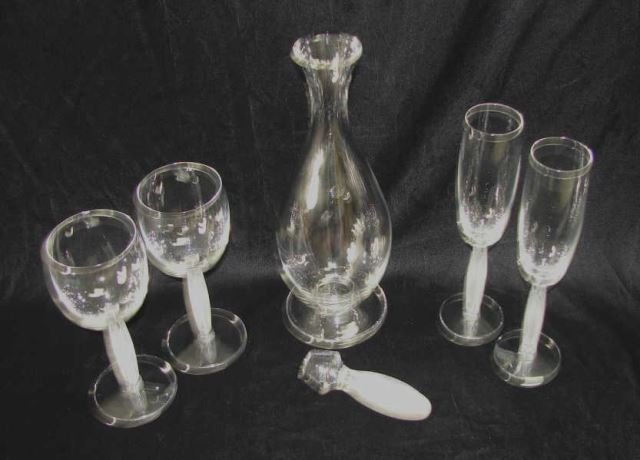 Lalique Decanter, 2 Wine, 2 Flutes, Diamant: Decanter, height - 15 inches w/ stopper. Wines, height - 7 inches. Champagne, height - 9 inches. Diamant pattern, excellent condition. The decanter and pair of wine glasses have the original boxes.