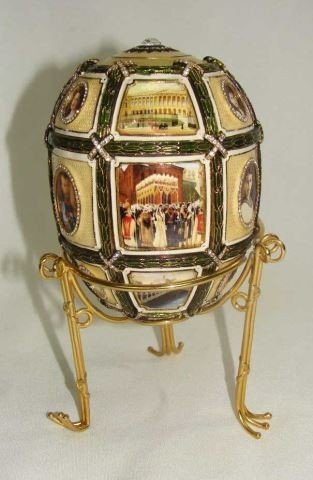 Faberge - Fifteenth Anniversary Egg: Imperial Collection, Replica. Egg the Fifteenth anniversary of reign is divided into eighteen sectors with 16 miniatures. Seven oval miniatures portraits of the Imperial family. No box or COA.