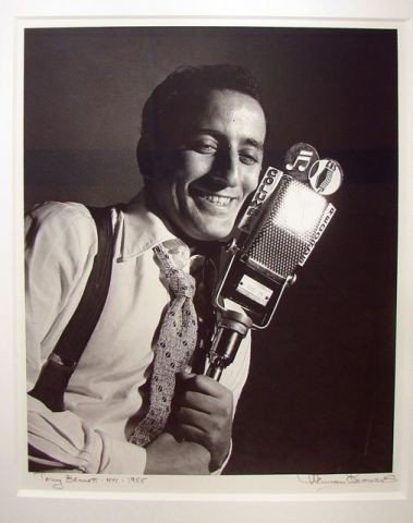 Herman Leonard Photo Tony Bennett, NYC, 1955.: Black and White photograph. Signed, dated and titled lower margin. 10 x 12 in. Framed under plexiglass. 20 x 22 ins. framed.