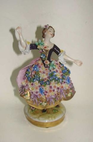 Dresden Porcelain Lacey Figurine Lady: A fine Dresden porcelain figurine of a dancing Lady in a flowered ball gown. Height - 8.5 inches. Condition: very very minor loss.