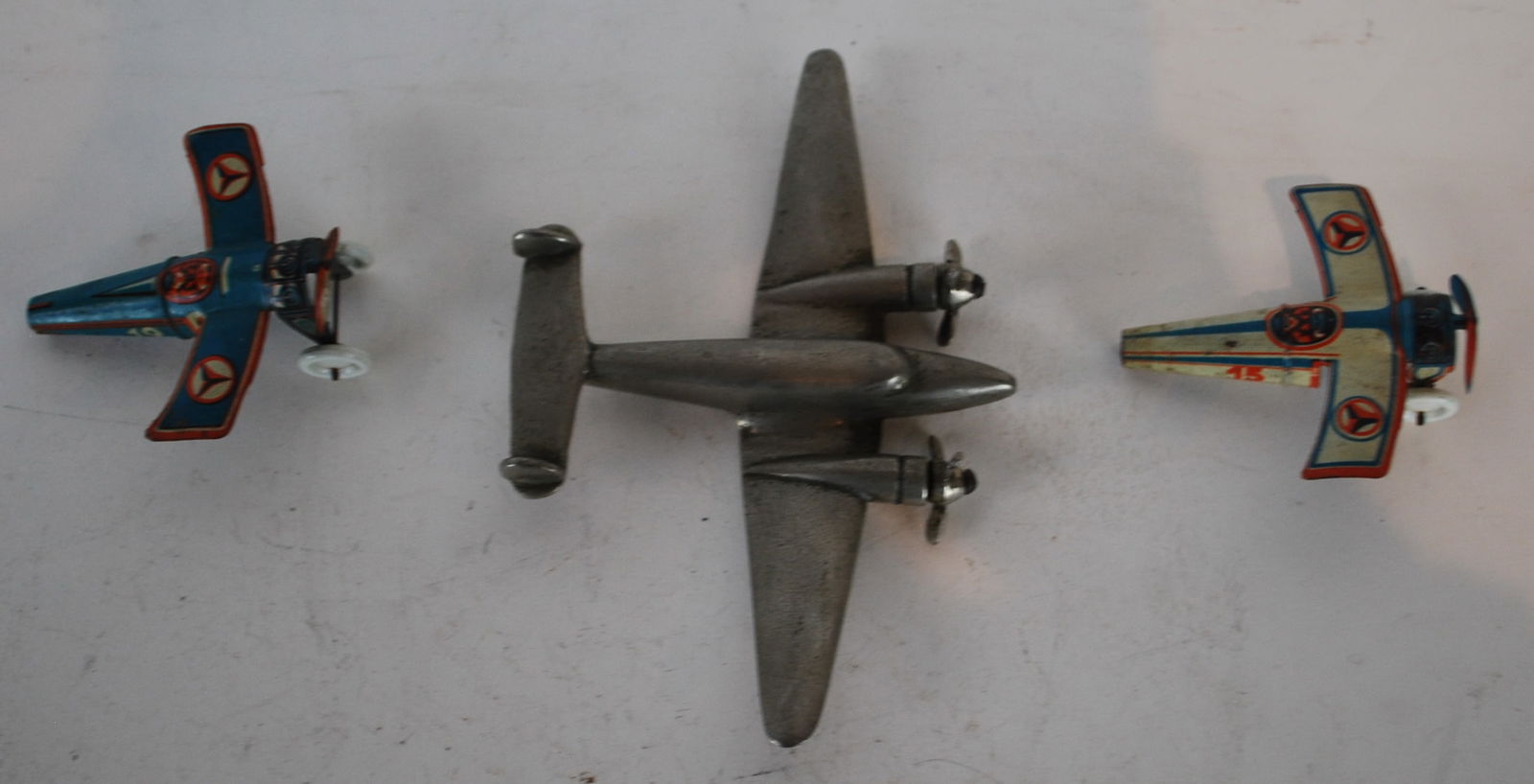 Cast Iron plane, 1930s with a pair of Penny Tin Toys, 1920s (1 of 4)