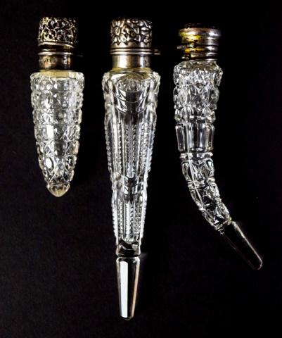 3 Sterling & Cut Glass Laydown Scent Bottles: 3 cut glass laydown perfume / scent bottles with sterling tops. Repousse floral top with lion, anchor, G Gorham Sterling maker's mark; openwork top with UB Sterling 925 Fine Unger Brothers maker's mar