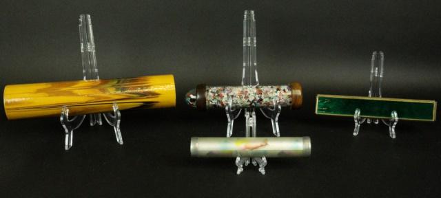 4 Kaleidoscopes: Wooden kaleidoscope, signed with artist's monogram and dated 1982, 13"L; triangular brass and green enamel, 9 1/2"L; frosted glass, 8"L; wood and glass with small stones, 10"L