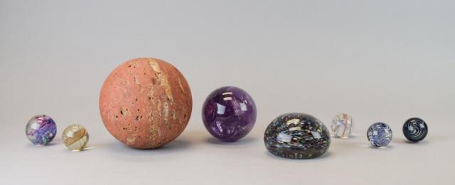 Grouping of Marbles & Paperweights: Italian marble paperweight, 4 3/4"H; purple glass orb, approximately 3"H; 5 large marbles, largest approximately 1 1/2"H; glass paperweight, 2"H x 3"-diameter. Wear and scratches to paperweight.