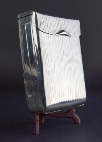 German 935 Silver Four-Fold Cigarette Case: Folding cigarette case with German silver crescent moon and crown hallmarks, stamped 935, with shield maker's mark on interior. Closed, 4 1/2" x 3 1/4" x 1 1/4"; open 17 3/4"L. 12.62 ozt