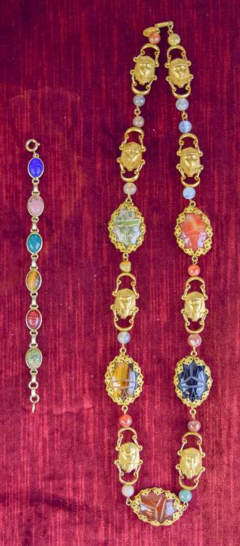 Miriam Haskell Egyptian Revival Necklace/Bracelet: Miriam Haskell, ca 1970, Egyptian Revival necklace featuring hardstone and acrylic carved scarabs on a gold tone chain with gold tone pharaoh masks accented with hardstone beads. Signed on clasp and h