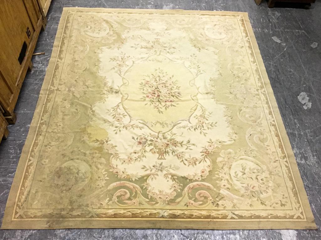 Floral Aubusson: Stains and wear throughout. 9' 9 1/2" x 8'1"
