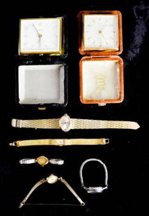 Grouping of Clocks & Watches: A grouping of clocks and watches, including Heco 7 jewel travel clock (not working), Linden travel clock, Bulova anti-magnetic watch, Geneva 17 jewel watch, Benrus watch with 14k gold case, Gruen Prec