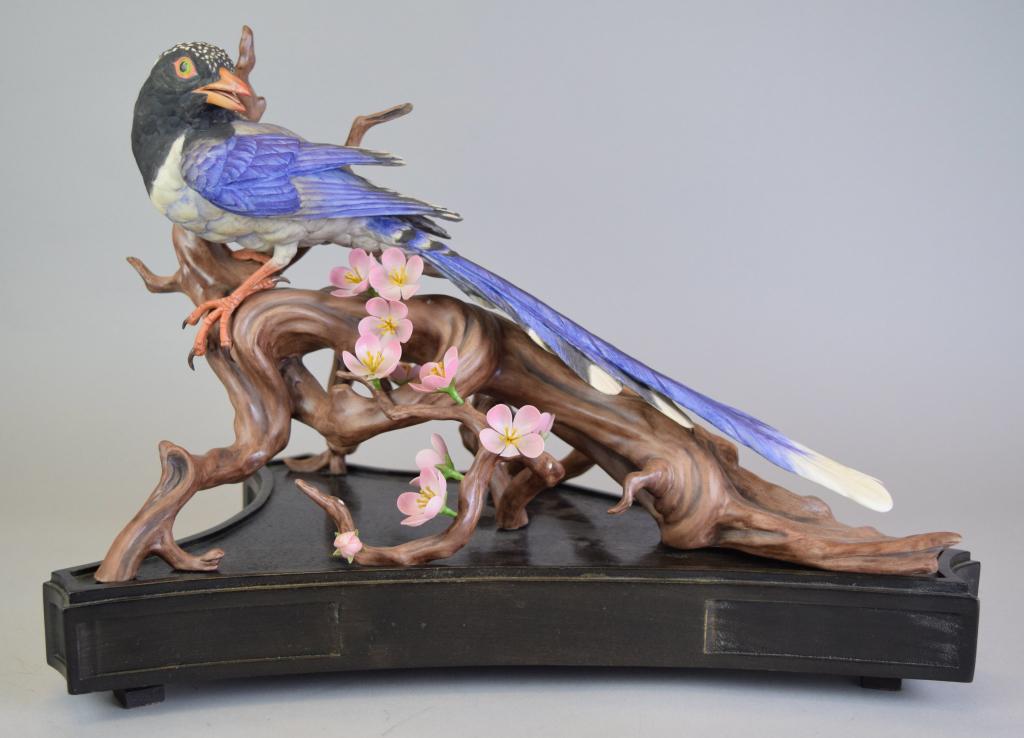 Boehm Red Billed Blue Magpie: Boehm bisque porcelain Red Billed Blue Magpie. Signed on the base and stamped on the underside Edward Marshall Boehm and Made in USA. Limited edition, numbered 59 and dated 1975. 10"H x 15"L. On woode