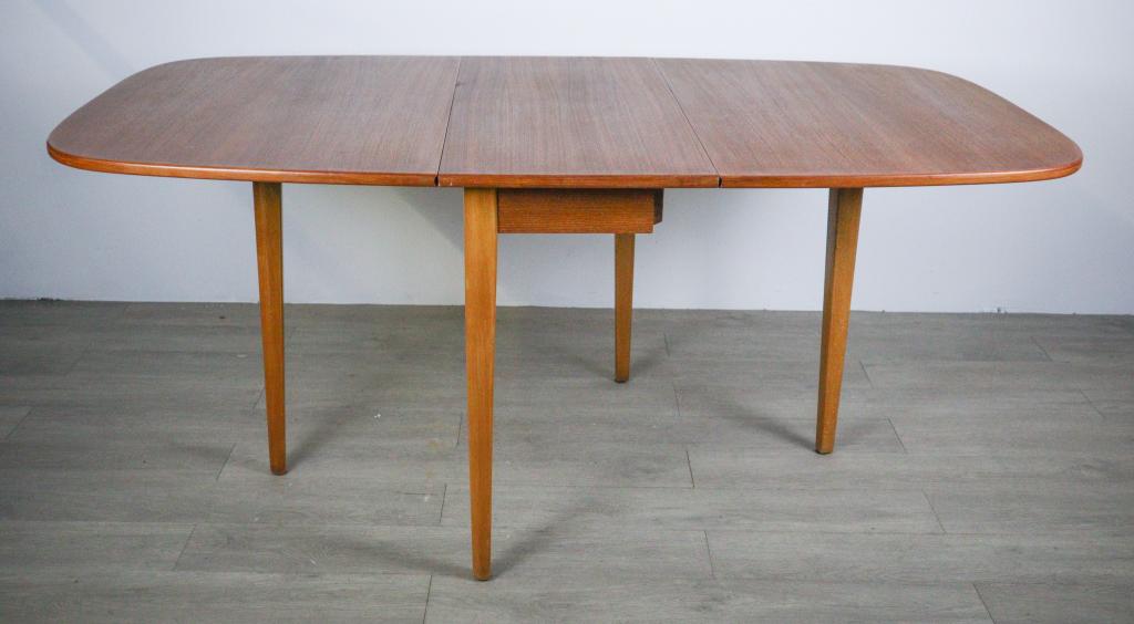 Danish Mid Century Modern Teak Drop Leaf Table: Danish Mid Century Modern Teak Drop Leaf Dining Table, in Style of Arne Vodder, Mid Century Modern 65" L X 37" W X 29" H 16" Closed Slight nick to Drop Leaf