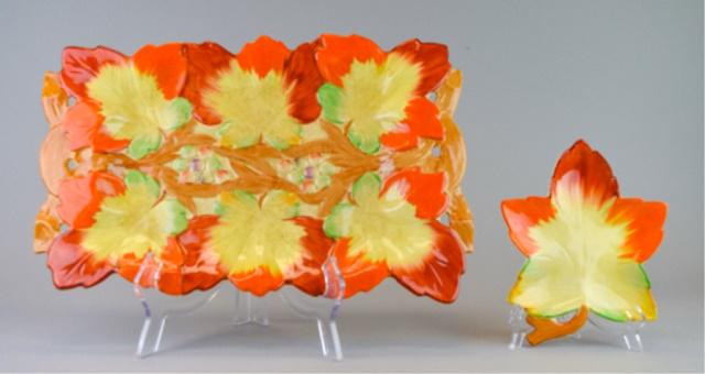 2 Pieces Clarice Cliff Leaf Pottery: 2 pieces Clarice Cliff English pottery. Wilkinson Ltd. leaf dish, 7 1/2" x 6"; Newport Pottery leaf tray, 15 1/2" x 10". Chip on rim of large tray chipped on underside.