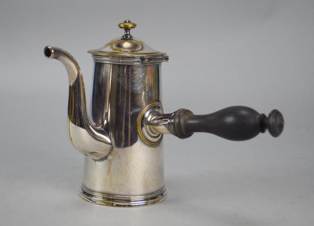 Christofle Silverplate Chocolate Pot: Silverplate chocolate pot with wooden handle, with Christofle marks on underside. 7 1/2"H. Minor wear throughout.