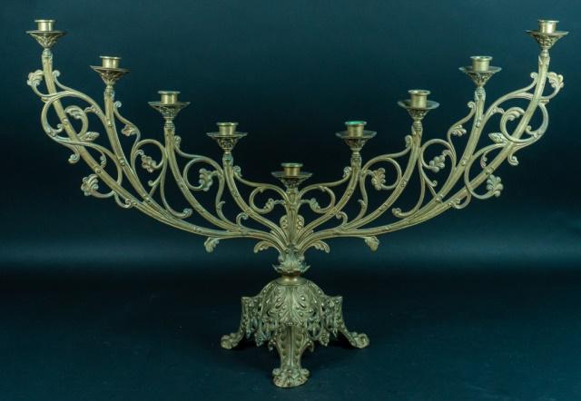 20th Century Brass Candleholder: Brass ornamented Menorah. 31 5/8" L x 21 1/2" H. Wax residue