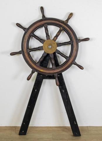 Nautical Ship Wheel John Hastie Greenock LTD: Nautical ship wheel John Hastie Greenock LTD. 19th Century, Greenock Scotland. Mahogany 8 spoke wheel with brass hub and support rail around the wheel. Inscribed John Hastie - Greenock Ltd. on 2 woode