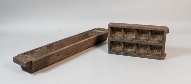 2 Metal Industrial Molds: 2 cast metal industrial molds. Long rectangular mold, 21 1/2"L; 8 section AJ Oster mold, 9 3/4" x 5 1/2" x 1 3/4". From the Roman and Williams designed 211 Elizabeth Street in New York City.