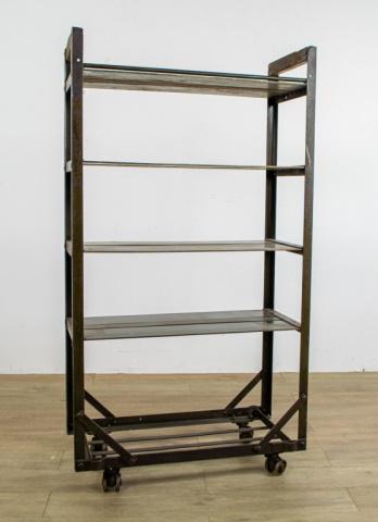 Industrial Factory Rolling Metal Shelf: Industrial iron shelf on wheels, with 4 shelves and bottom shelf open - cross bands on bottom. 54" H X 29 1/2" W X 13" D. From the Roman and Williams designed 211 Elizabeth Street in New York City.