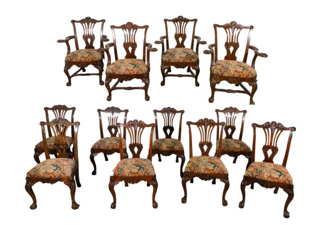 A Set of Twelve George III Style Irish Chairs: Set of twelve George III Style Irish carved chairs. 19th Century or earlier. Bow shaped top rail with centered acanthus leaf and "C" scroll motif flanked with corners embellished with scalloped shells