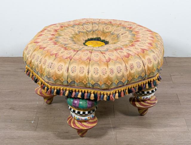 Mackenzie Childs Octagonal Upholstered Ottoman: Mackenzie Childs octagonal floral upholstered ottoman, paint decorated porcelain feet. Slight wear to the central silk button. 19" H X 31"Diameter