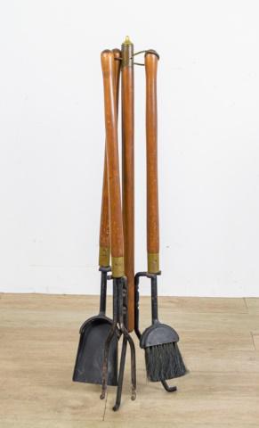 Danish Modern Fireplace Tools & Log Holder: Set of Danish Modern fireplace tools. Metal base with wooden pole, set consists of brush, shovel and poker, all with wooden handles. 38 1/2" H. Together with an iron and leather log holder. 16"L x 11 