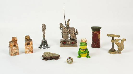 Grouping of Decorative Accessories: Grouping of decorative accessories including brass squirrel nutcracker, carved jade monkey on carved stand, porcelain frog box, pair of Foo dog marble bookends, halcyon enamel pill box, Post Office