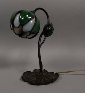 Handel Style Tulip Form Lamp: Handel style tulip lamp. Glass shade lamp with metal base. 13" H x 6 1/2" Diameter. Cracks to one leaf in the shade.