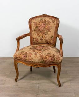 Carved Walnut Upholstered Open Arm Chair: Walnut upholstered open arm chair with carved top, arms and feet. 36" H X 26" W X 18" D