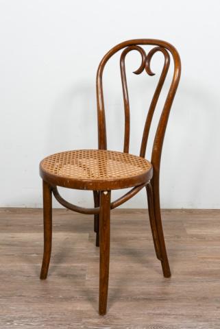 Thonet Bentwood Caned Chair: Thonet bentwood caned chair. American, Early 20th Century. Circular caned seat, curved bentwood heart-shaped splats. Wear and scratches to splats. 36" H x 16" L x 21" D