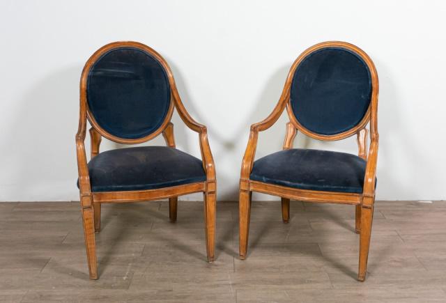 Pair of Louis XVI Style Carved Fauteuil Armchairs: Pair of Louis XVI style carved fauteuil armchairs. Mid 20th Century. Oval blue velvet upholstered back splat and seat, with blue and gold pin striping on reverse of splat. Wears and stains to seat, lo