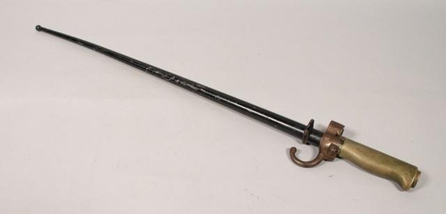 World War I French Bayonet: World War I French bayonet. French, Early 20th Century. Steel rod scabbard with black lacquer, four-edged blade. Marked with two P's within circles on hilt, blade is marked with B in a diamond. Hilt s