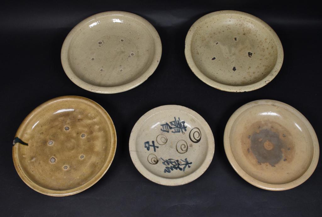 5 Japanese Earthenware Platters: 5 Japanese earthenware platters. Japan, 18th, 19th Century. 5 glazed pieces fired in a kiln, indentations from stacking the pieces in the kiln can be seen on all. Piece of interest includes a platter 