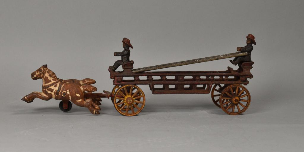 Cast Iron Horse Drawn Fire Engine: Cast iron horse drawn fire engine, with two horses, two firemen and a ladder. 14 3/4" Length.