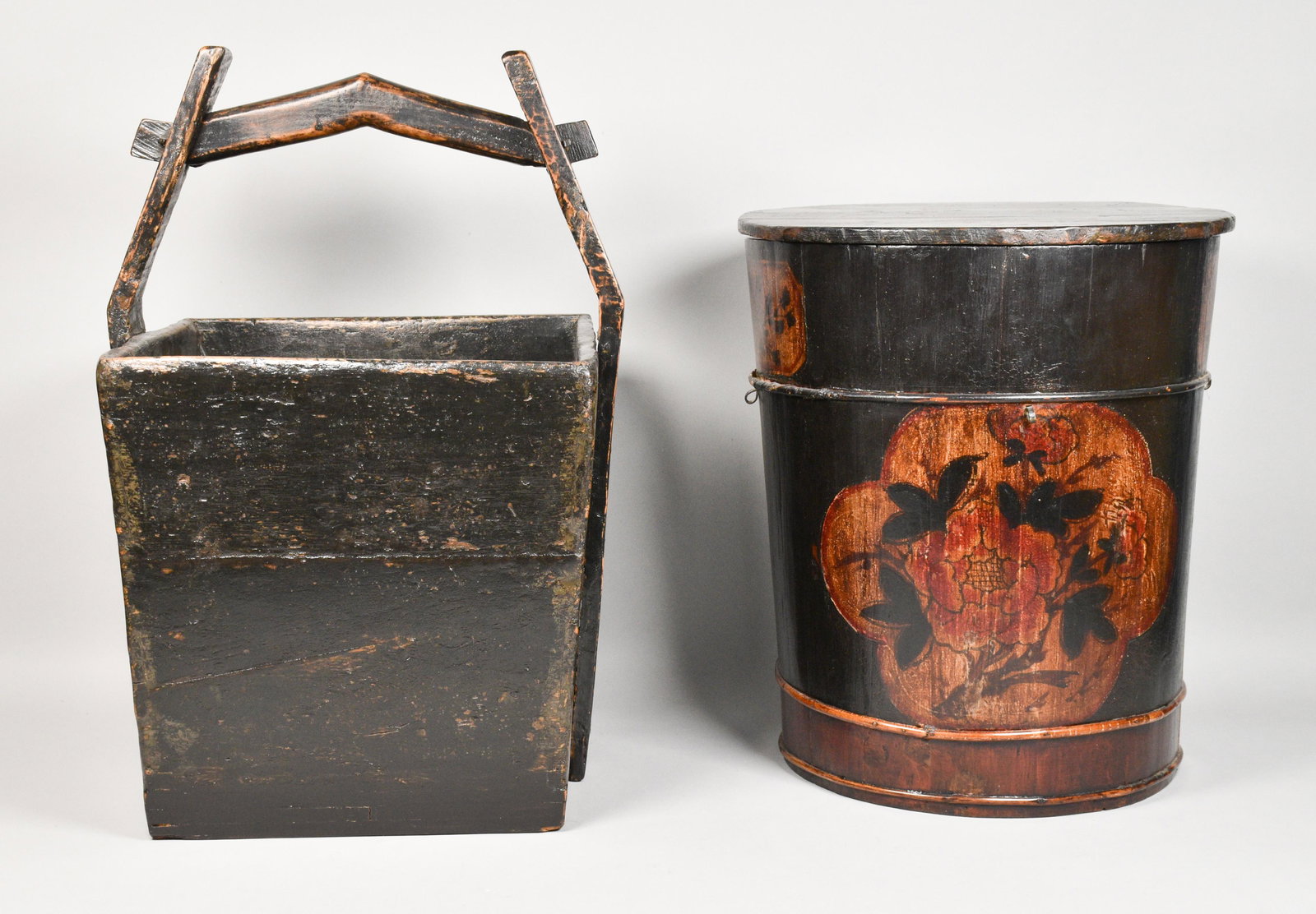 Chinese Water Bucket and Rice Pail: Chinese water bucket and rice pail. Chinese, Late 19th Century. Wooden black-painted bucket designed to carry rice or water. Wear around edges, cracking on base. A rice pail with black paint, painted