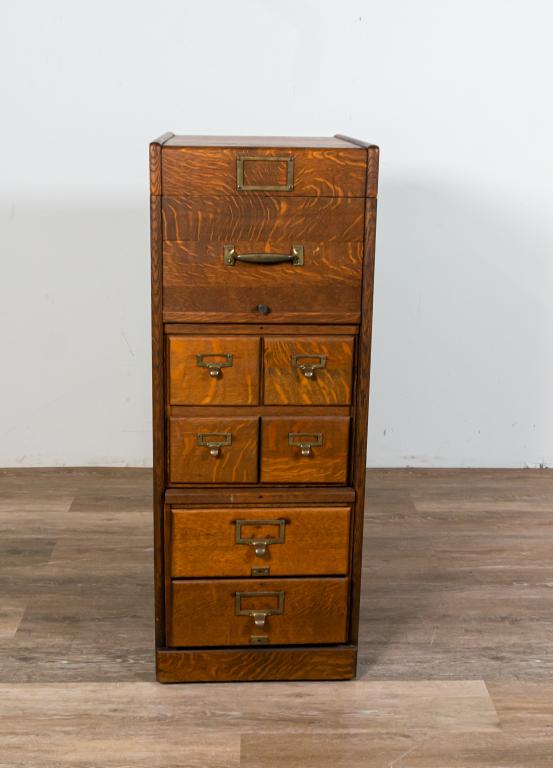 Library Filing Cabinet and Card Catalog: Library filing cabinet and card catalog. American, early 20th century. Filing cabinet on wheels, with a top faux drawer that opens on the top with hinges, four card catalog drawers, and two lower draw