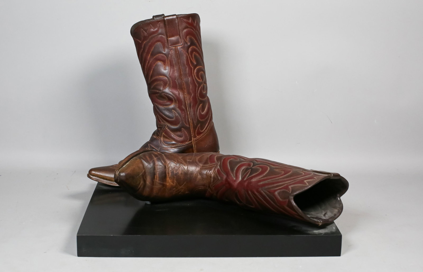 Scott Hanson Cast Bronze Cowboy Boots: Scott Hanson (American, California, 20th century). Cast bronze Article #3 Boots. Signed and numbered 2/99. 15" H x 18" L x 19" W