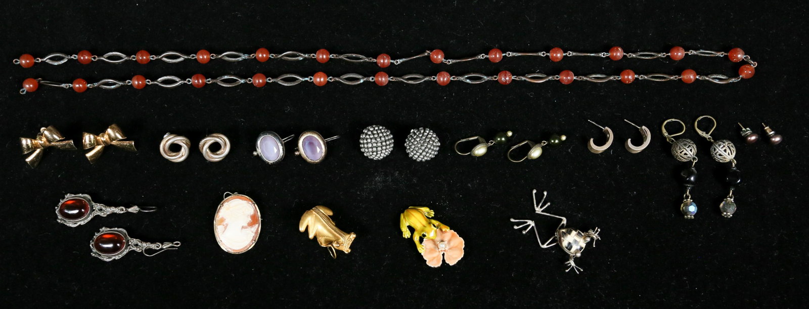 Grouping of Costume Jewelry: 9 pairs of earrings, small hoops, dangle and studs. 3 brooches, 1 cameo and 2 frogs. 1 necklace with carnelian stone, 16 1/4" L.