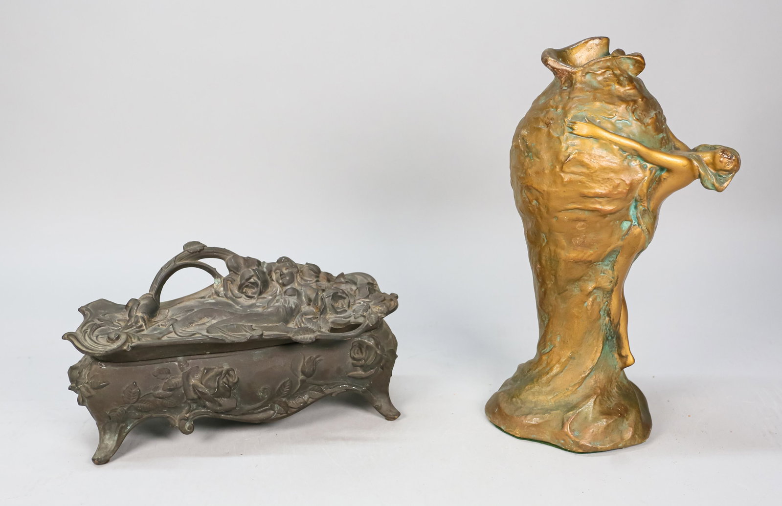 Art Nouveau Jewelry Casket and Pottery Vase: Weidlich Brothers figural metal art nouveau jewelry casket. Red velvet interior. Marked on the underside WB Mfg. Co. Art Nouveau painted pottery vase in the style of Van Briggle pottery. Jewelry caske