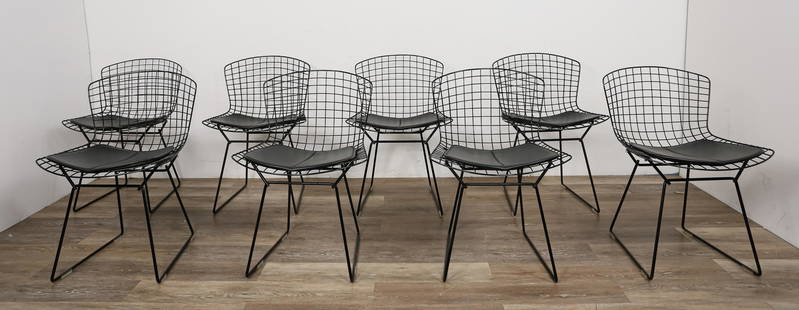 8 Harry Bertoia Mid-Century Modern Side Chairs: Harry Bertoia (Italy, 1915-1978) for Knoll International. 8 mid-century modern side chairs. Welded black steel with Sabrina leather cushions. Scratches to backs. One chair cracked and partially