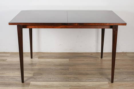 Kurt Ostervig Danish Modern Dining Table: Kurt Ostervig (Danish, 1912-1986) for Brande Mobelindustri. Danish modern dining table. Danish, mid 20th century. Rosewood, tapered dowel legs and feet, two removable leaves with black water resistant