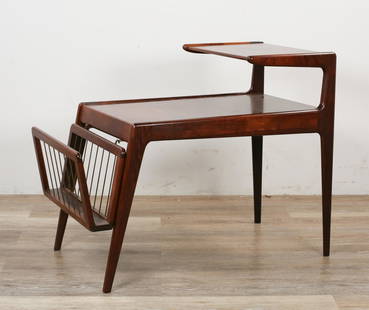 Kurt Ostervig Danish Side Table / Magazine Rack: Kurt Ostervig (Danish, 1912-1986). Danish Modern side table with magazine rack. Mid 20th century. Rosewood with slender dowel feet, step-down tier with detachable magazine rack on front. Scuff to